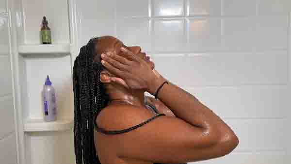Washing your hair helps soften stiff synthetic braids