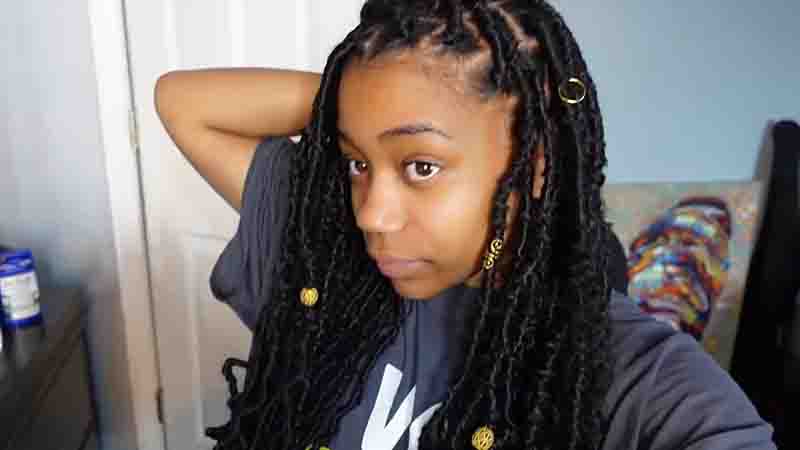 Bohemian Soft Locs hairstyle with loose curls and accessories